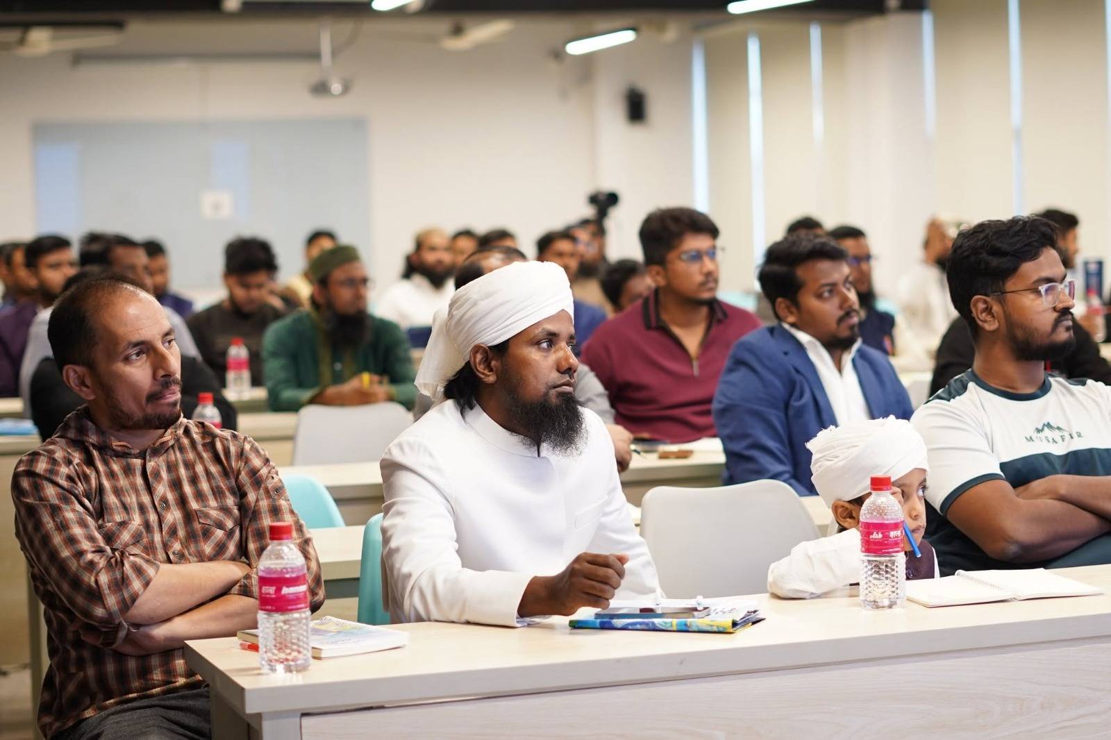 Omer Sharif with founders and guests at a workshop