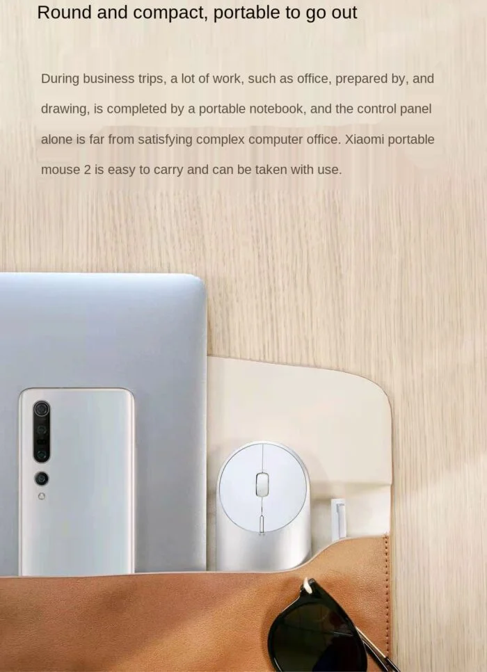 Xiaomi Portable Mouse 2 in hand showing ergonomic grip